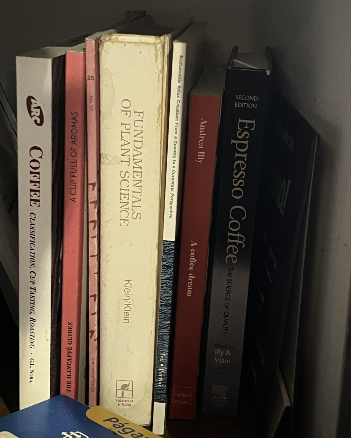 A working shelf of classic coffee and plant-science reference books