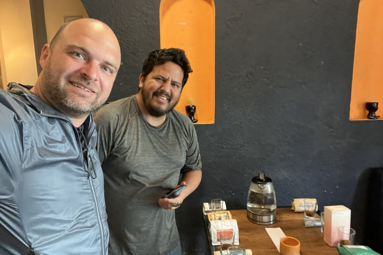 John Austin comparing coffees with a coffee professional